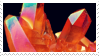 Stamp with reddish crystals in multiple colored hues